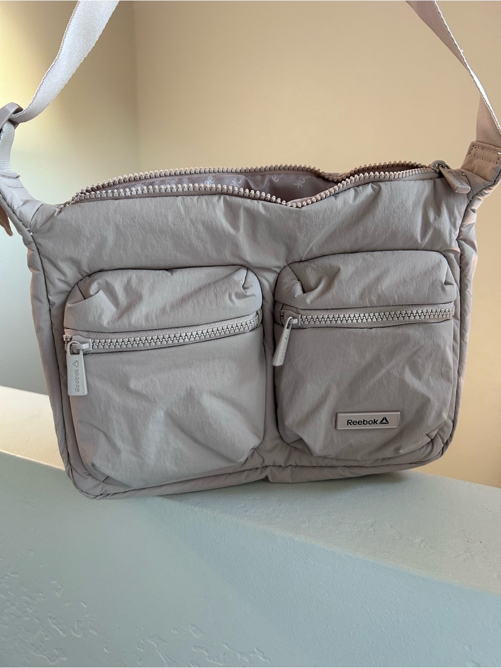 Reebok Quilted Crossbody Bag in Light Gray